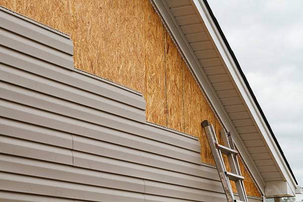 Professional Storm Damage Siding Repair technician working in Mount Morris, PA